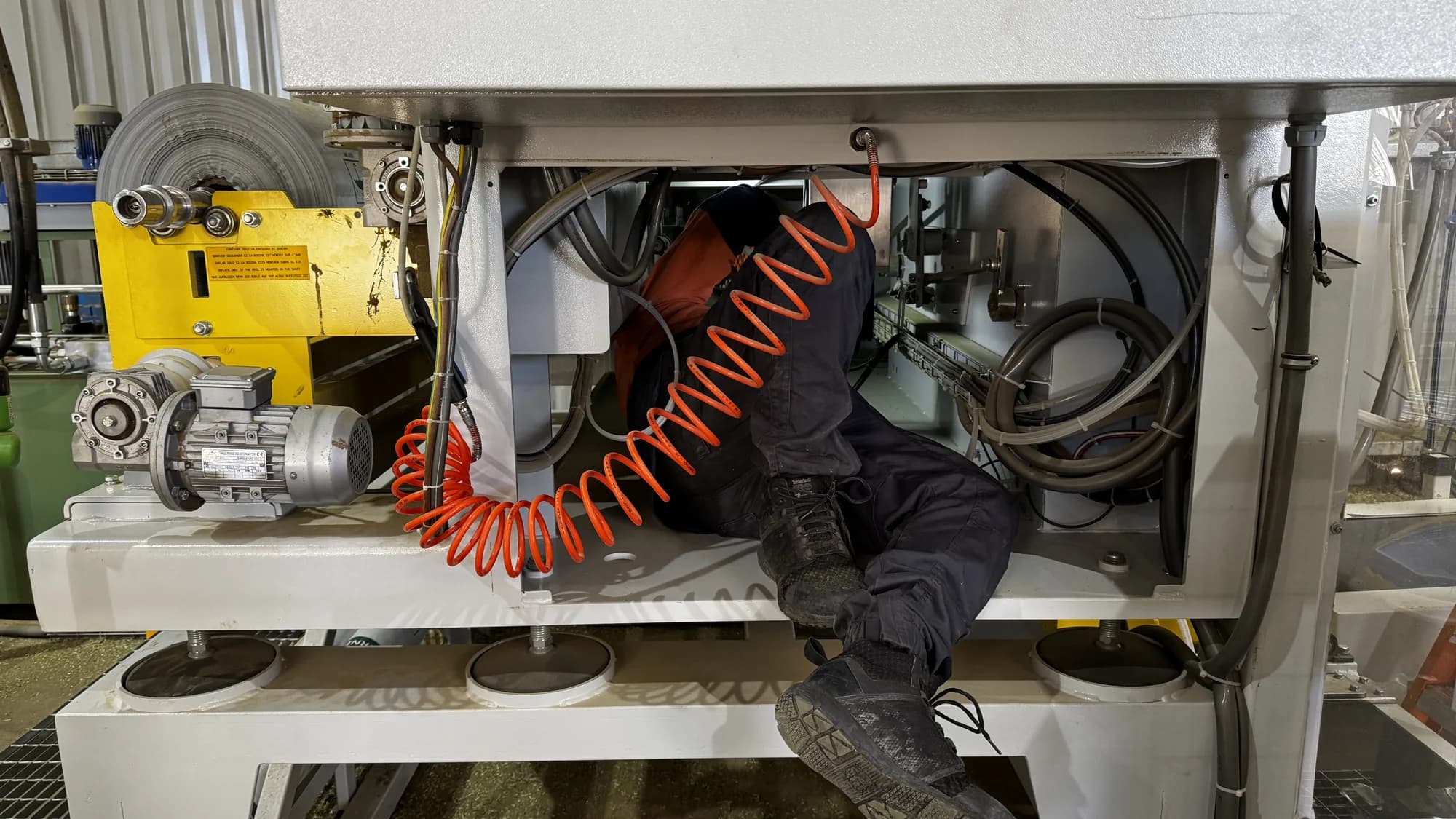 INCAS technician servicing a machine on the plant floor